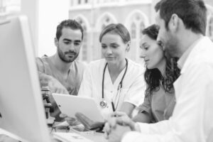 Doctors gathered around a computer
