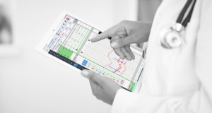 Clinician holding iPro AIMS and using the vitals chart